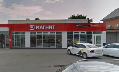One rejected Magnit store candidate and its neighboring building.
